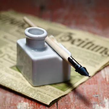 Old ink quill Stock Photos