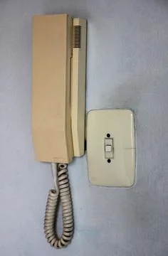 Old intercom and button on a wall Stockfoto's