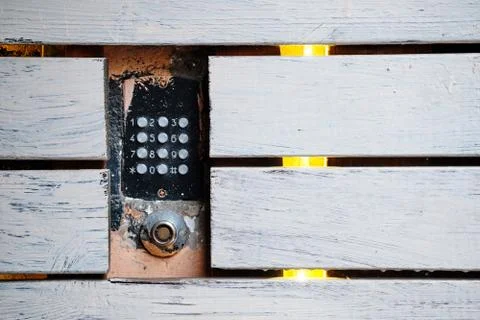 An old intercom with a magnetic key space mounted in the facade. There are wo Stock Photos