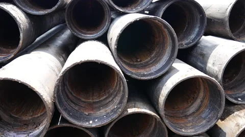 Old intermediate oilfield casing just pulled out of hole Stock Footage 54656637