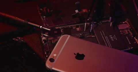 Old iPhone on top of broken Smartphone. Repairing old Smartphone. Stock Footage 237406729