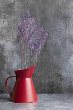 Old iron container with dehydrated flower inside Stock Photos