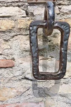 Old iron hinge or an arm for mooring of boats Stock Photos