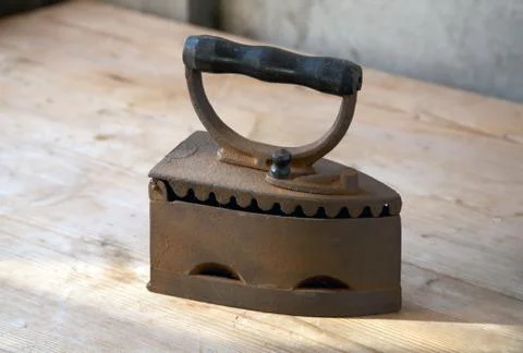 The old iron on a table in beams Stock Photos