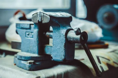 Old iron vise on the table Stock Photos