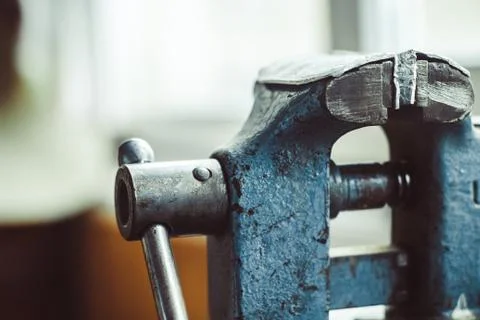 Old iron vise on the table Stock Photos