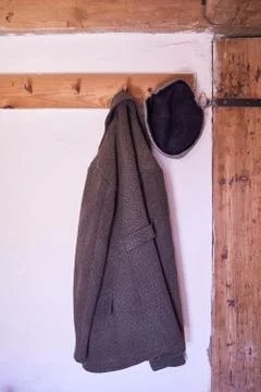 An old jacket hanging on a hanger Stock Photos