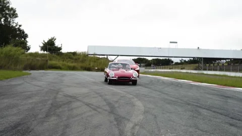 Old jaguar i pace car on the road Stock Footage 155605951