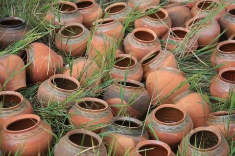 Old jars lying on the grass Stock Photos