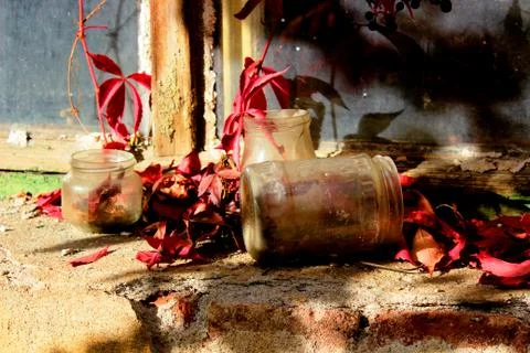 Old jars on an old window Stock Photos