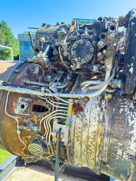 Old jet engine displayed outside at an aviation museum on a sunny day Stock Photos