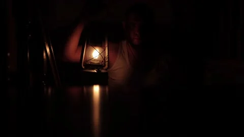 An old kerosene lamp is a light in the dark. There is no electricity Stock Footage