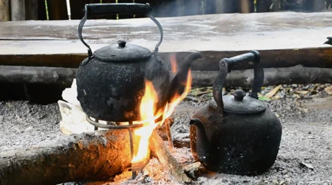 Old kettle on bonfire of countryside thailand Stock Footage 32240010