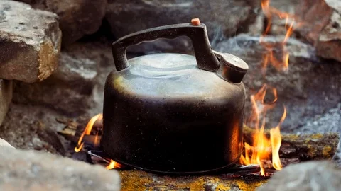 https://images.pond5.com/old-kettle-camping-fire-boiling-footage-117133283_iconl.jpeg