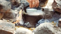 An Old Kettle Over The Camp Fire. The Kettle Boils Water For Tea Stock  Photo, Picture and Royalty Free Image. Image 84570904.