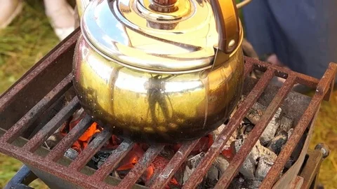 The old kettle on charcoal Stock Footage 78275617