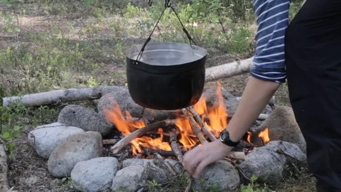 Old kettle on a marching fire Stock Footage 79524486