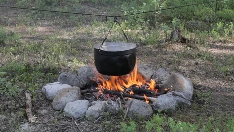 Old kettle on a marching fire Stock Footage 79524488