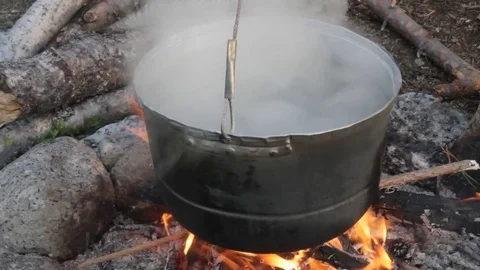 Old kettle on a marching fire Stock Footage 79526340