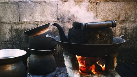 Old kettle placed on a stove in the kitchen of the villagers in the countryside. Stock Footage 102173569