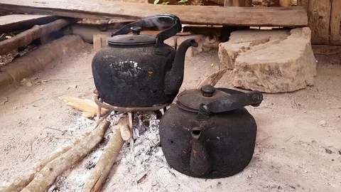 Old kettle put in fire place outdoor for boiling water Stock Footage 82473172