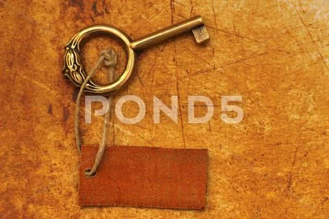 Old key and tag Stock Photos