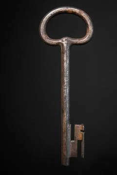 Old key on black background Stock Photos
