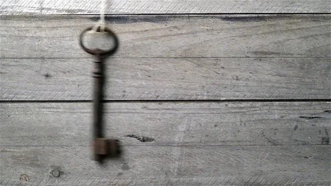 Old key hanging on a string Stock Footage 71424599