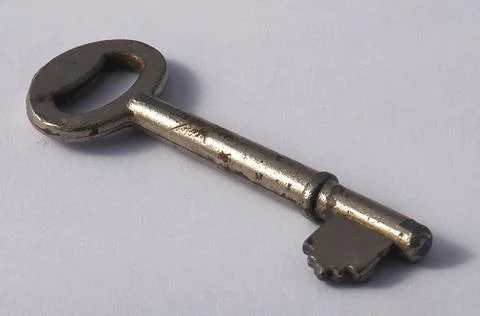 Old key isolated on white background 库存照片