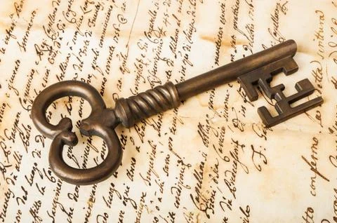 Old key on letter Stock Photos