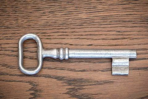 Old key on old table Stock Photos