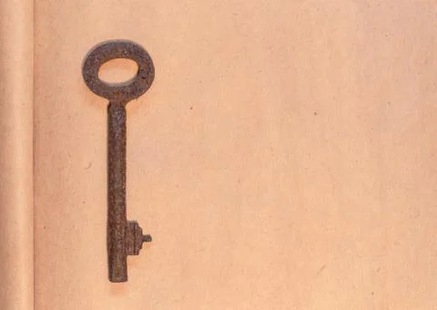 Old key on paper background Stock Photos