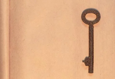 Old key on paper background Stock Photos