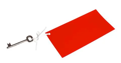 Old key with red label Stock Photos