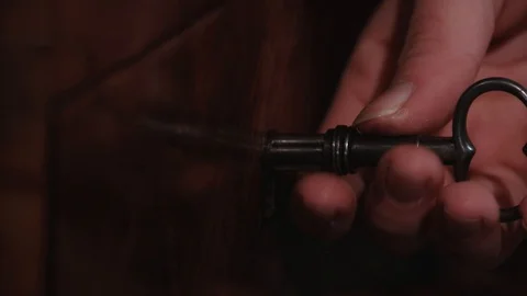 Old key unlocks secret compartment Stock Footage 101113060