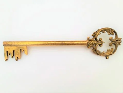 Old key on white background. Stock Photos