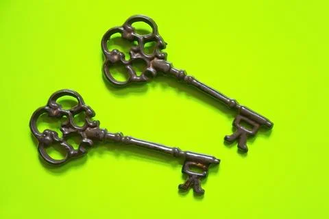 Old keys on color background Stock Photos