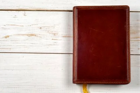 Old keys on a old book on rustic wooden background. Copy space for text. Stock Photos