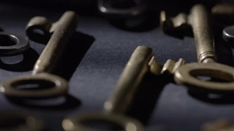 Old keys rotating over black background Stock Footage 119571332