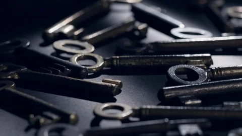Old keys rotating over black background Stock Footage 119572525