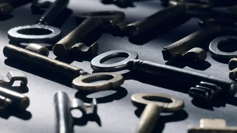 Old keys rotating over black background Stock Footage 119573012