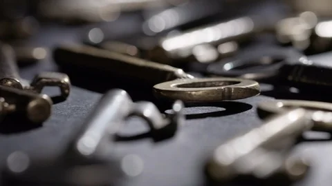 Old keys rotating over black background Stock Footage 119573861