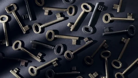 Old keys rotating over black background Stock Footage 119573900