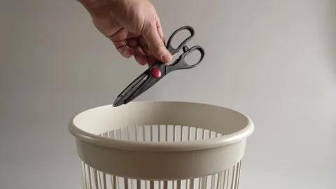 Old kitchen scissors are thrown into the trash for recycling Stock Footage 260531640