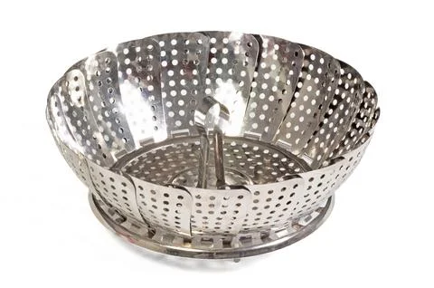 Old kitchen tool for boiling vegetables, place it in a pan with little water Stock Photos
