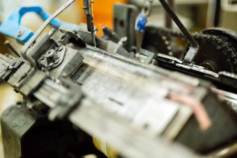 Old knitting machine in function Fotos de archivo