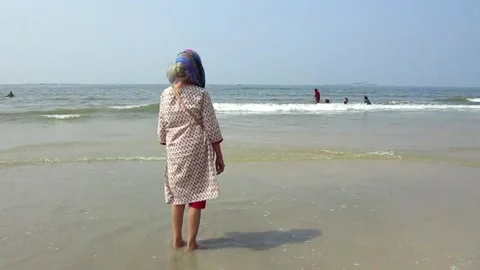 Old lady by the beach Stock Footage 154328552