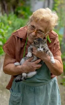 Old lady with cat Stock Photos