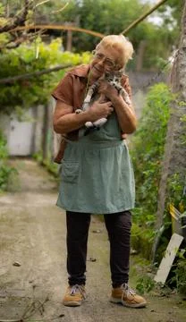 Old lady with cat Stock Photos
