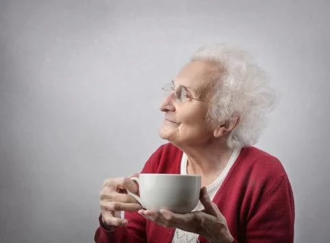 Old lady with a cup of tea Stock Photos